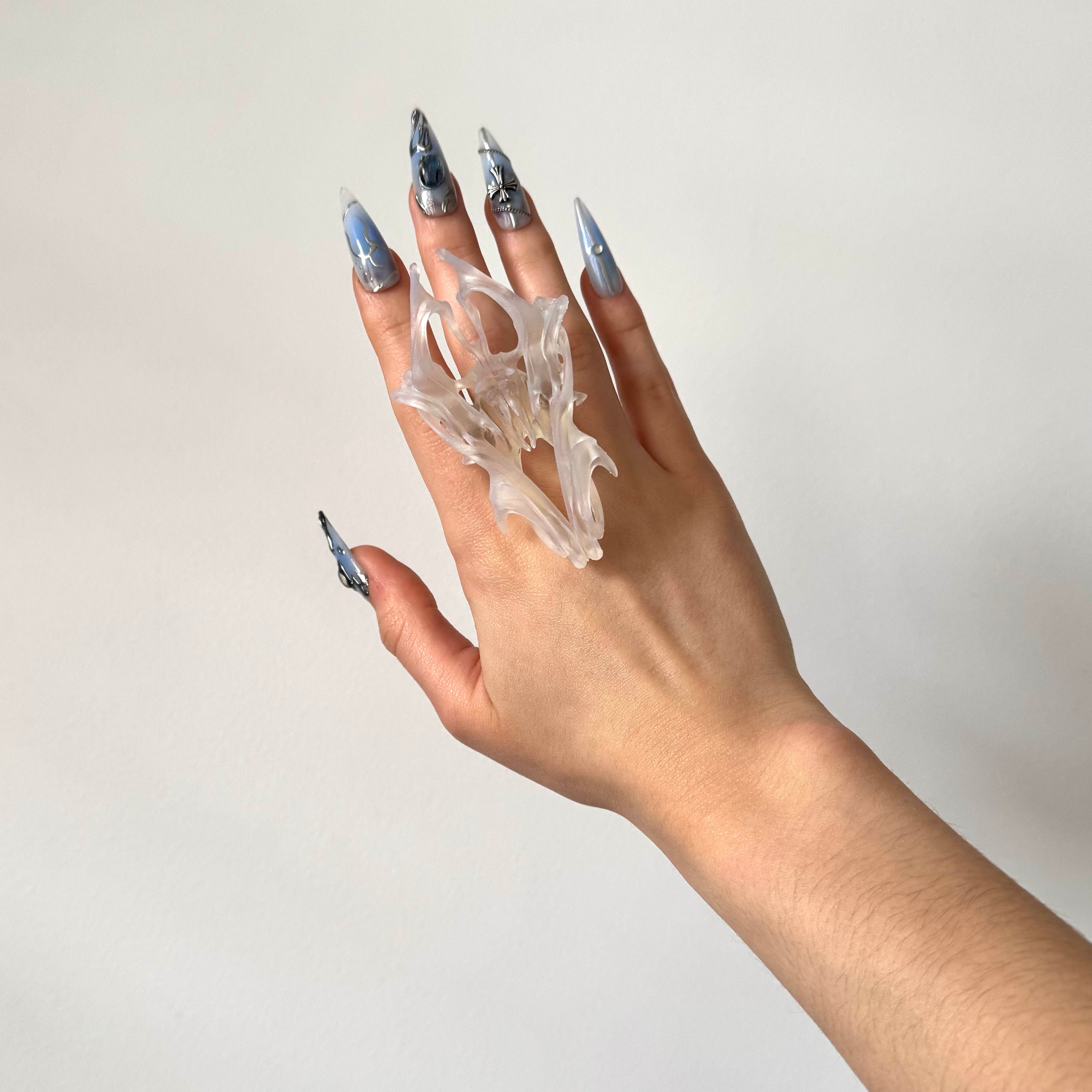 Hand wearing a statement clear chunky 3D printed ring.