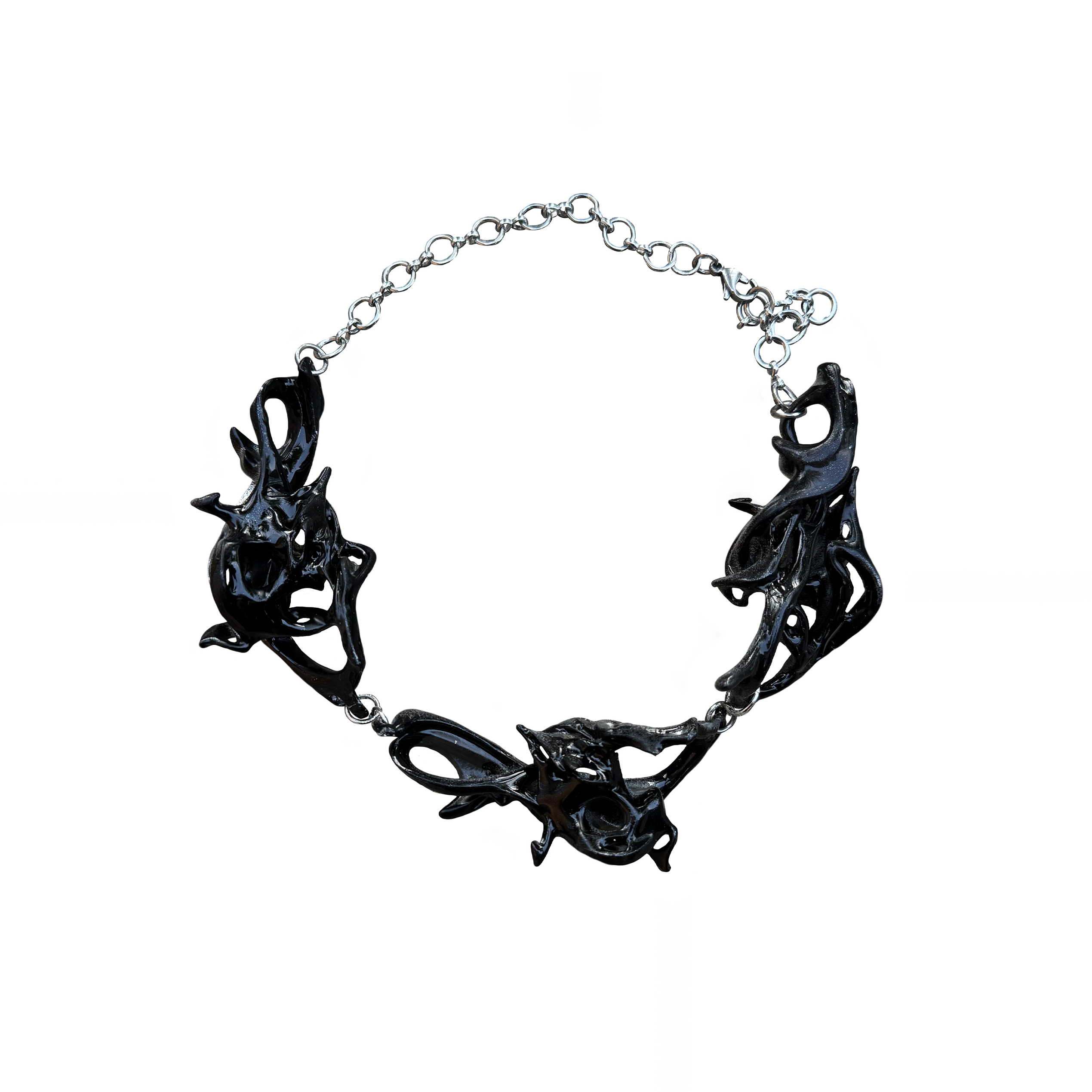 Black fossil inspired necklace on a white background