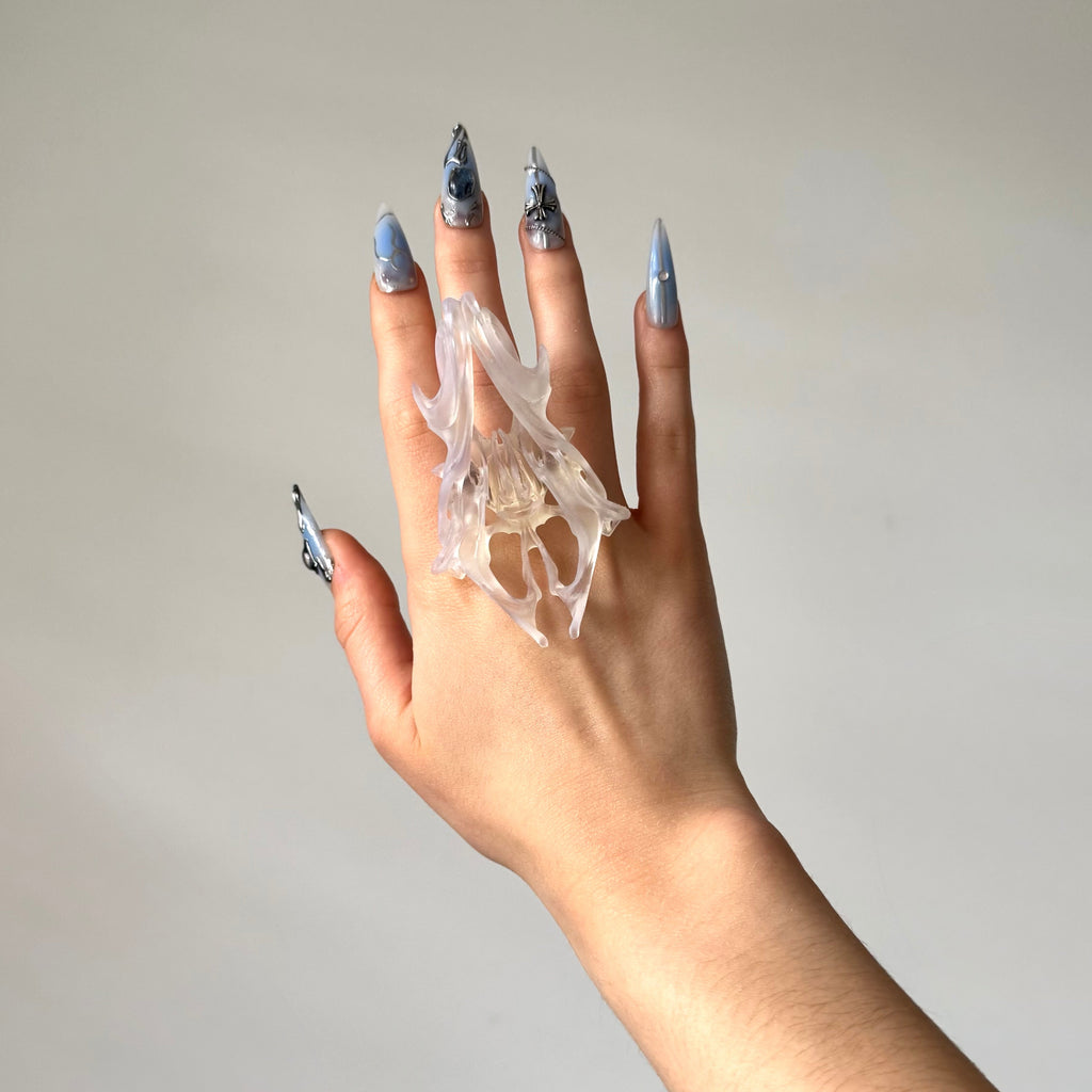 Hand wearing a statement clear chunky 3D printed ring.