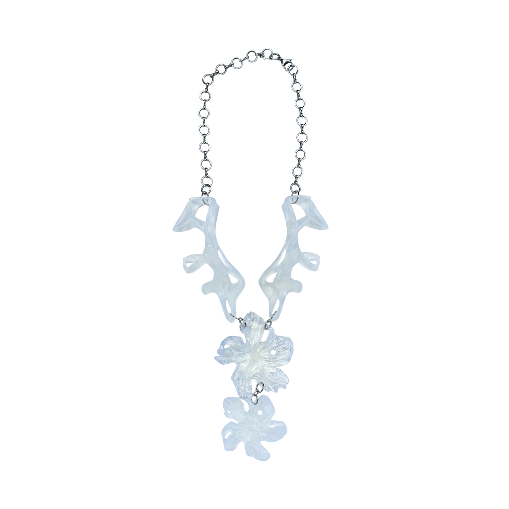 Necklace with floral and fossil inspired pendant with sterlin silver chain