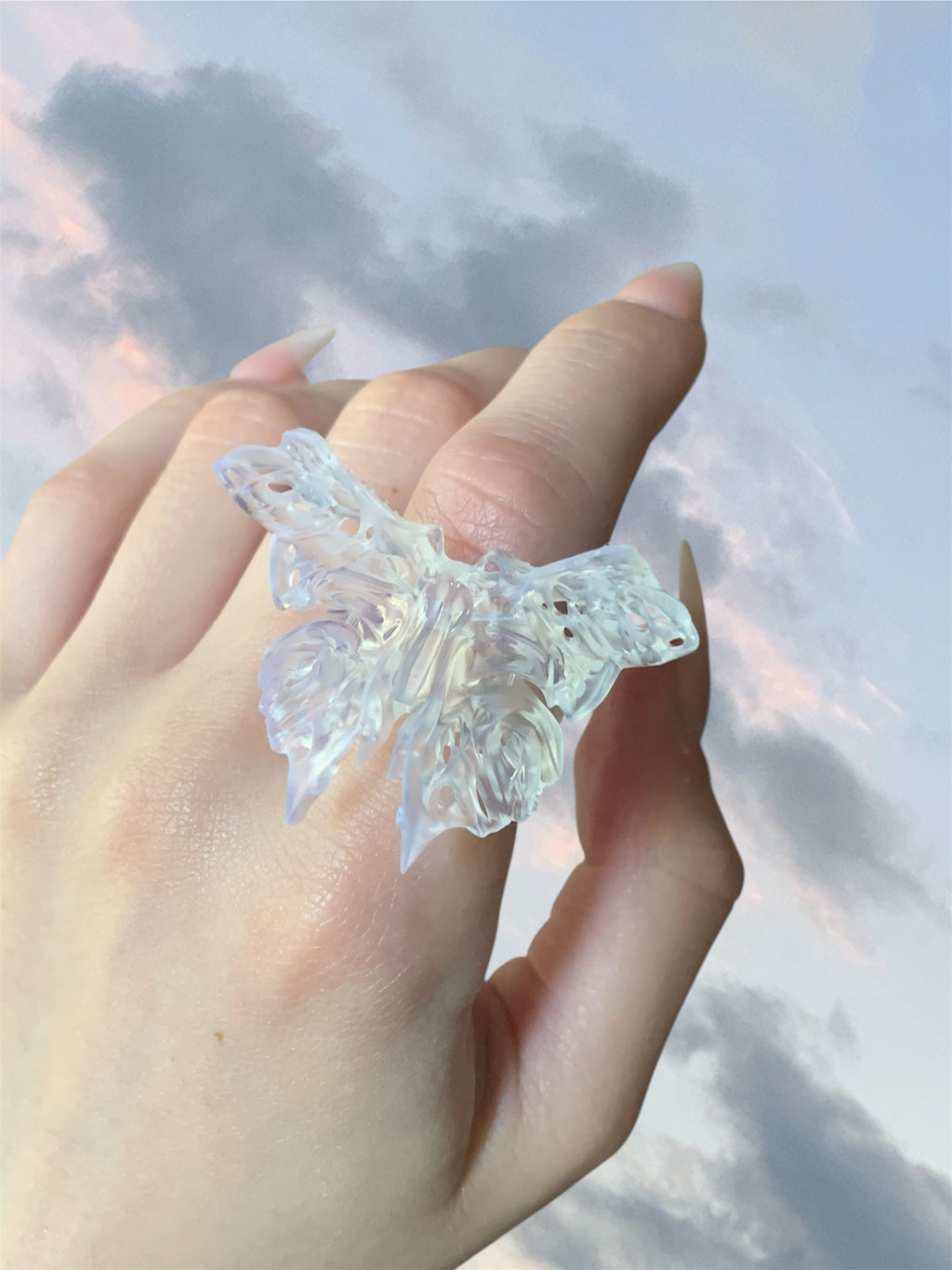 Hand wearing a statement 3D printed butterfly ring