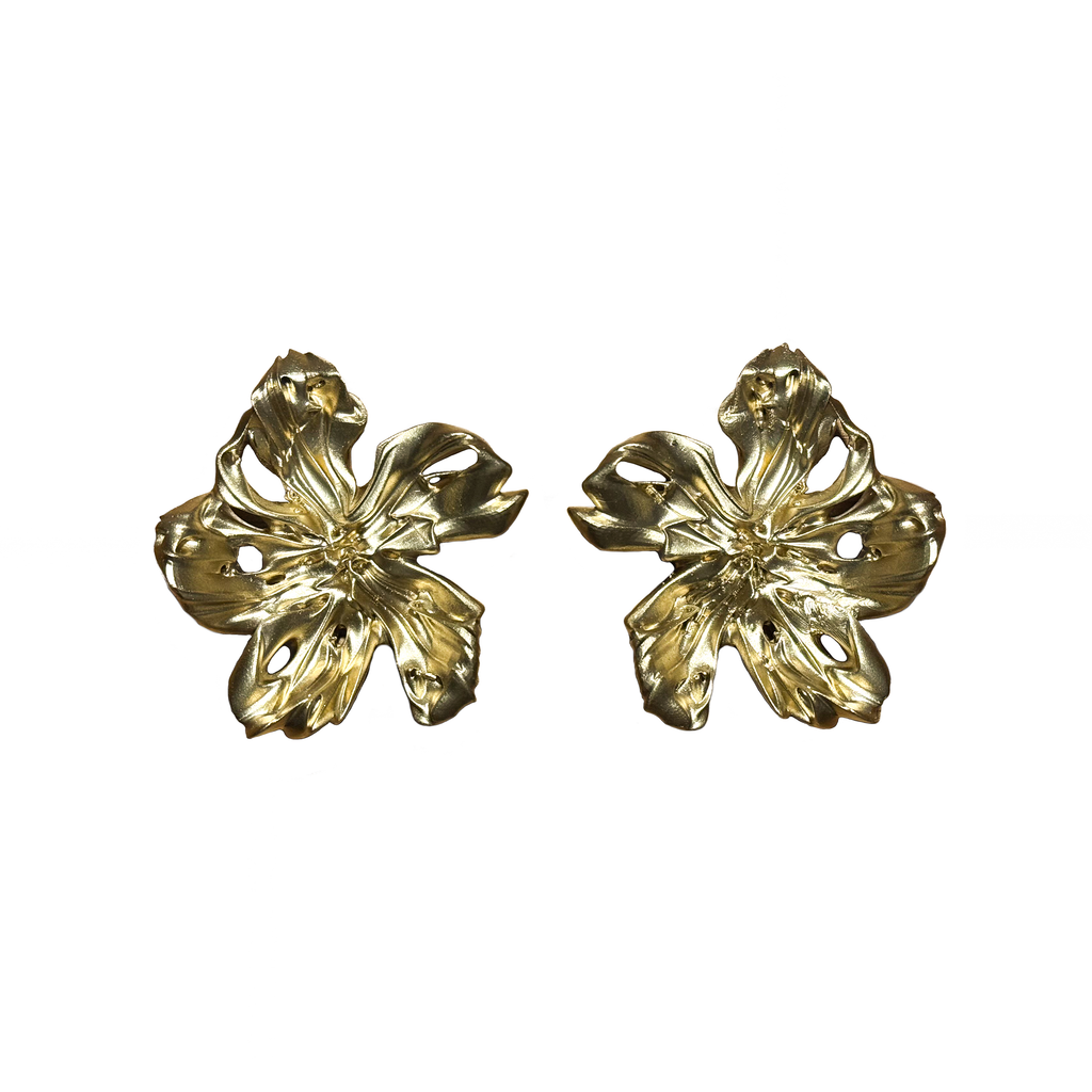 Pair of gold floral earrings on a white background