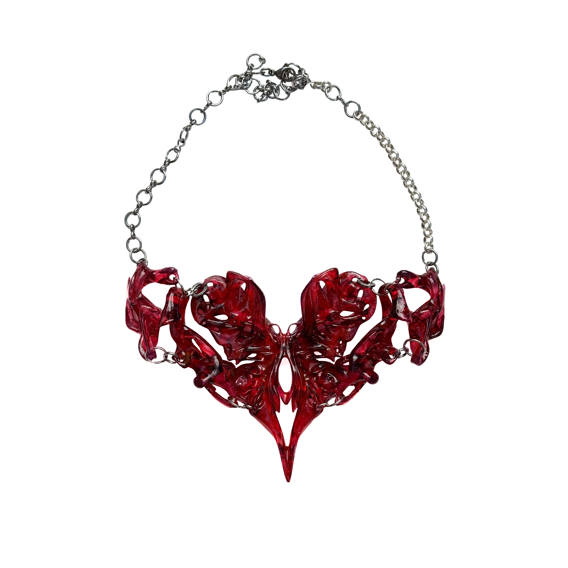 Red abstract heart necklace on a white background