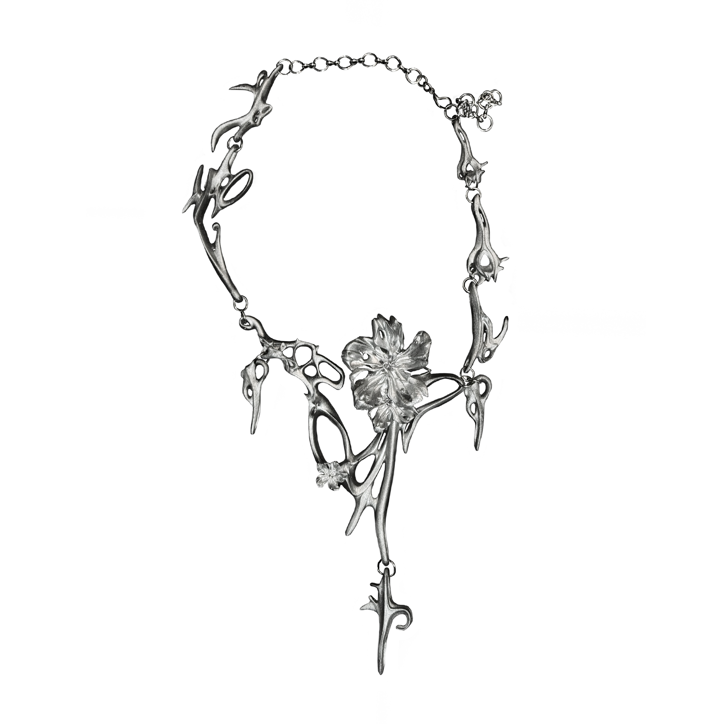 Silver necklace with floral design on a white background