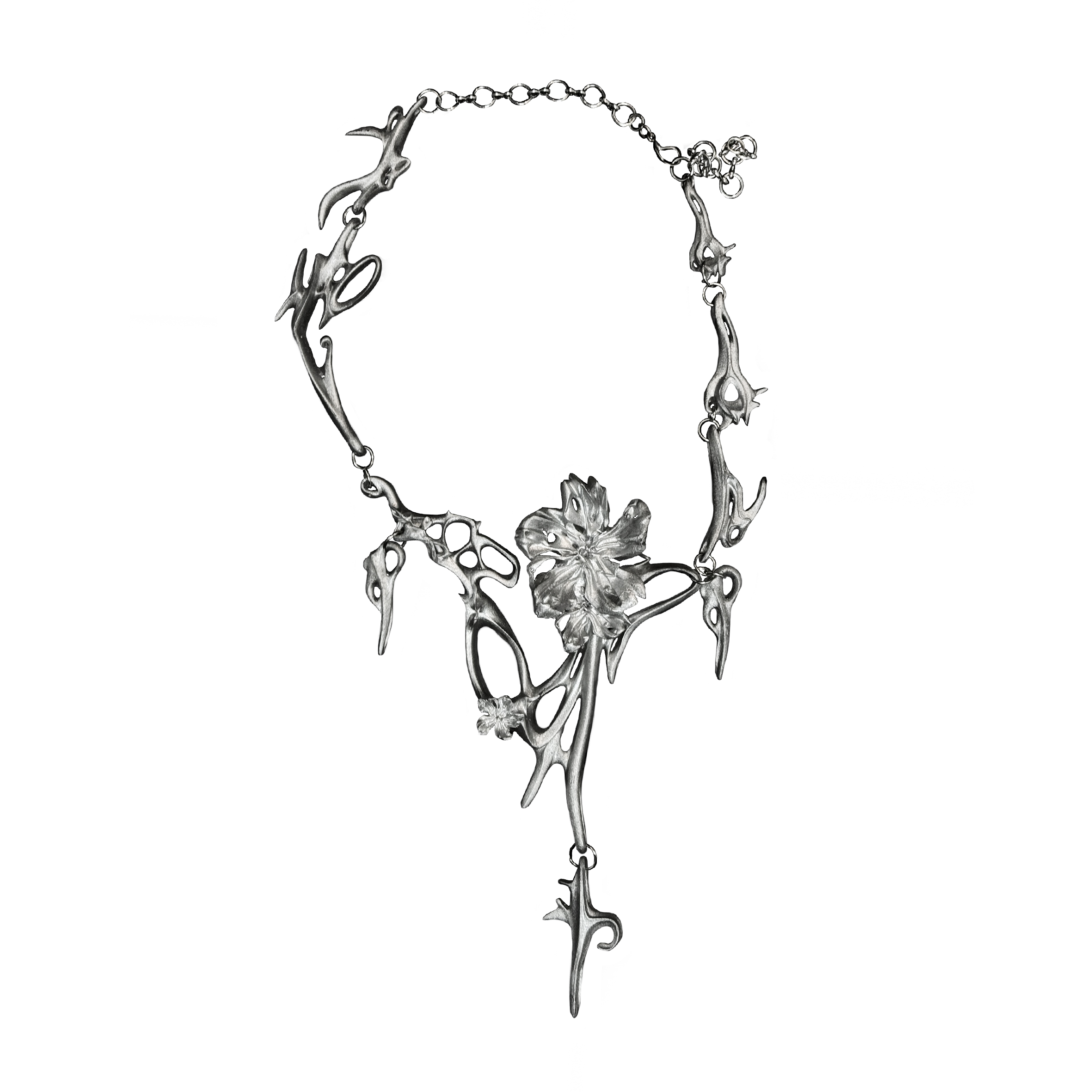 Silver necklace with floral design on a white background