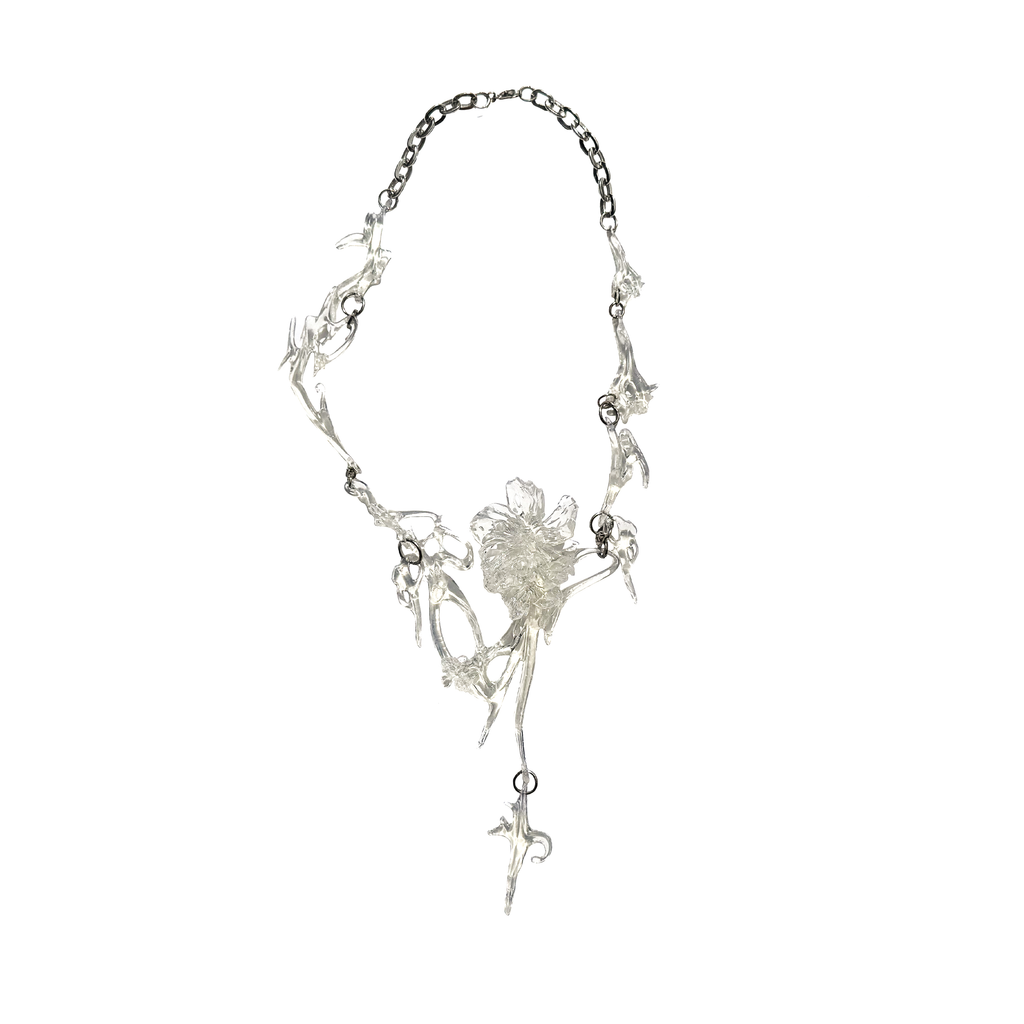 Clear gloss necklace with floral design on a white background