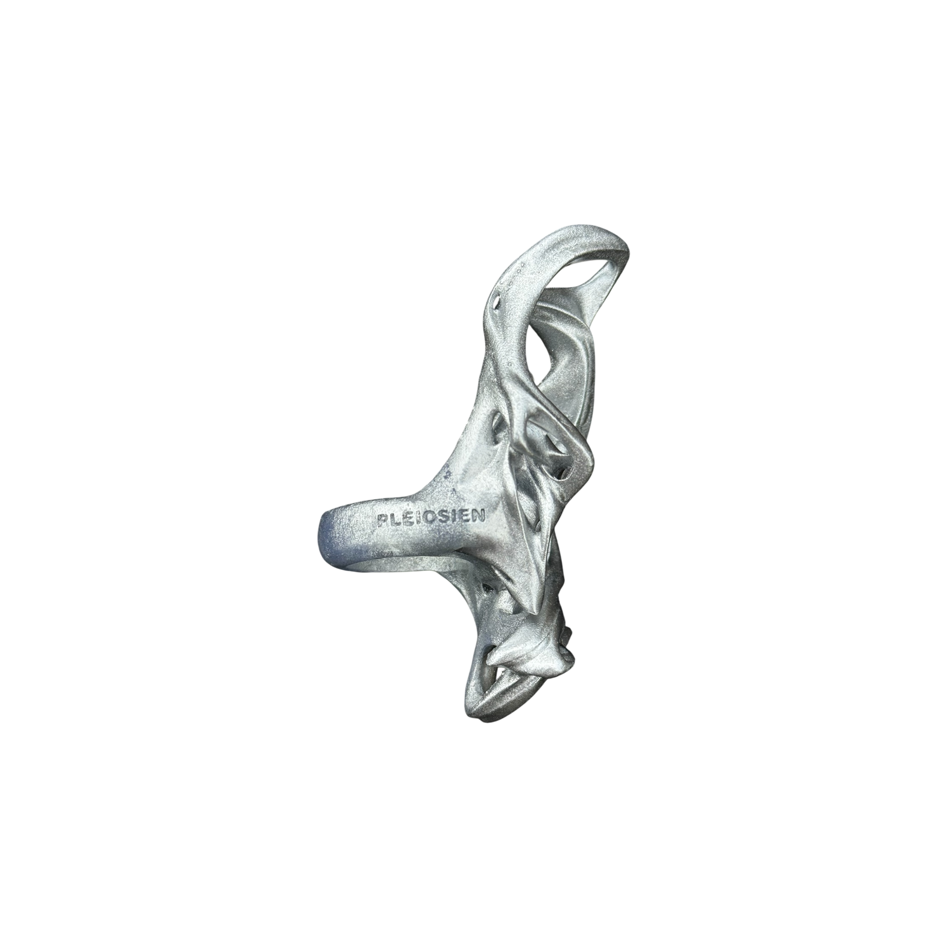 Silver ring with intricate design on a white background