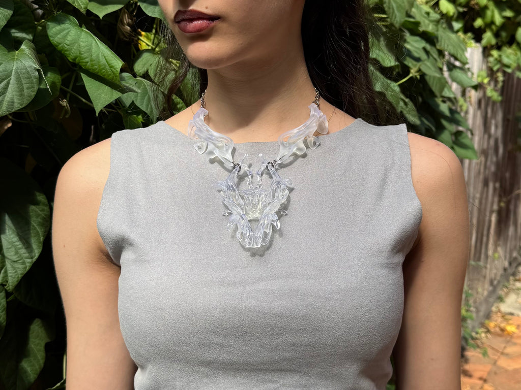 Woman wearing an abstract 3D printed necklace