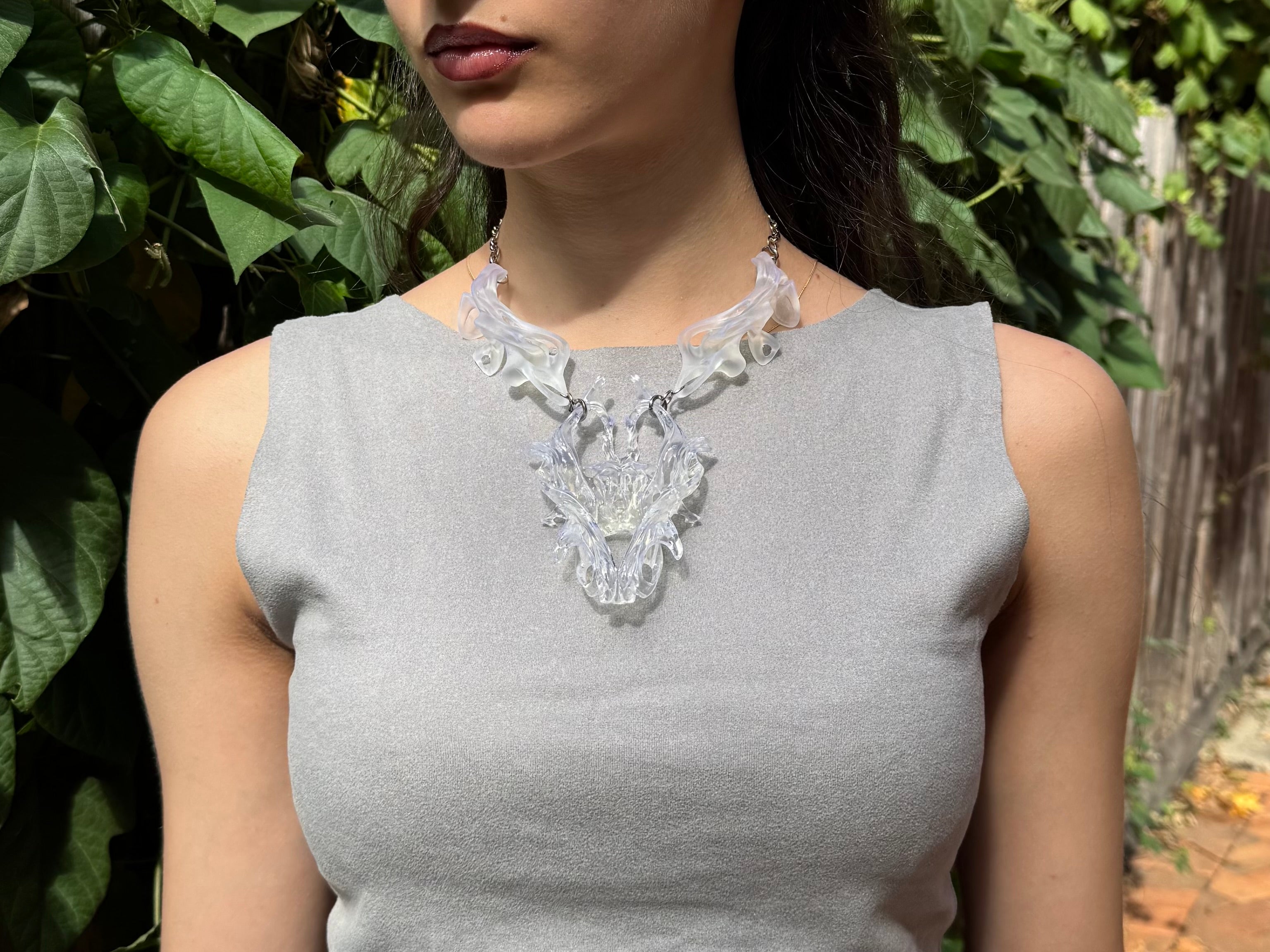 Woman wearing an abstract 3D printed necklace