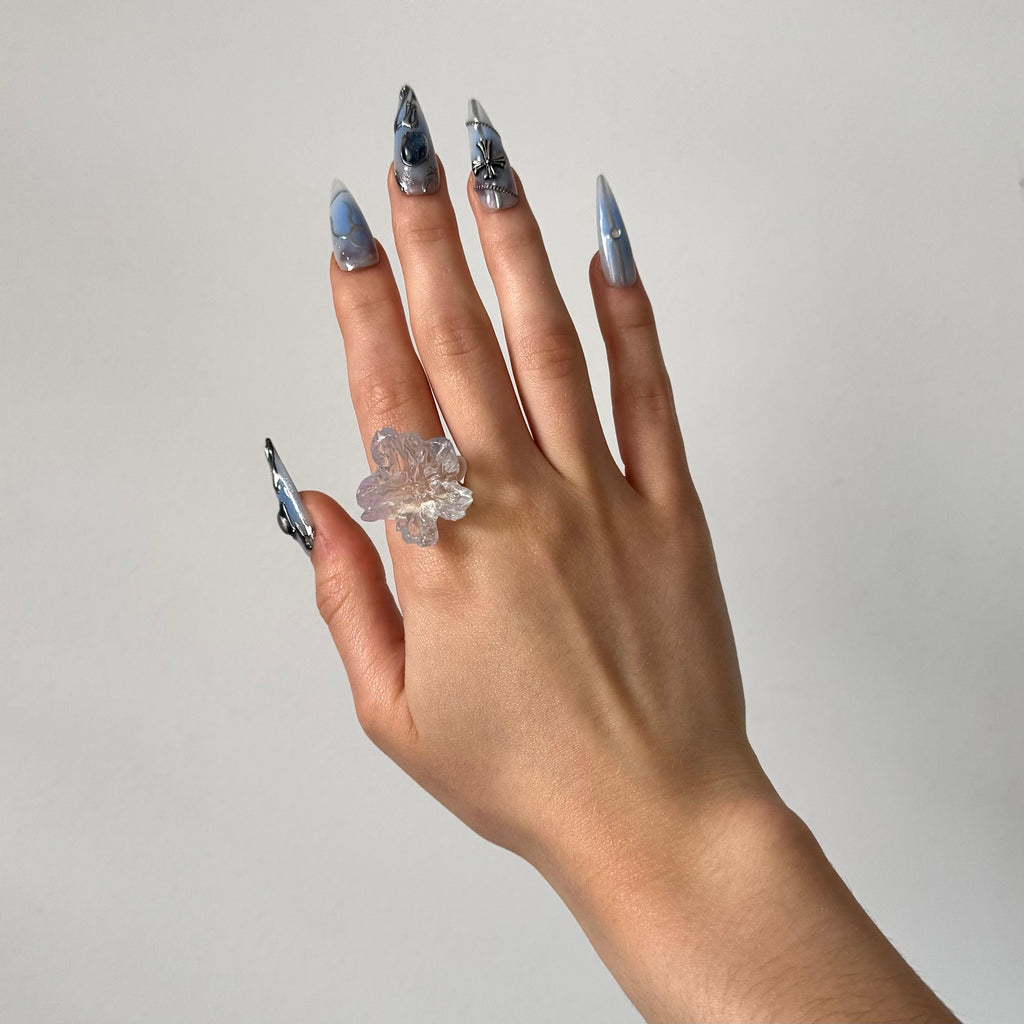 Hand wearing a clear glossy 3D printed resin statement ring