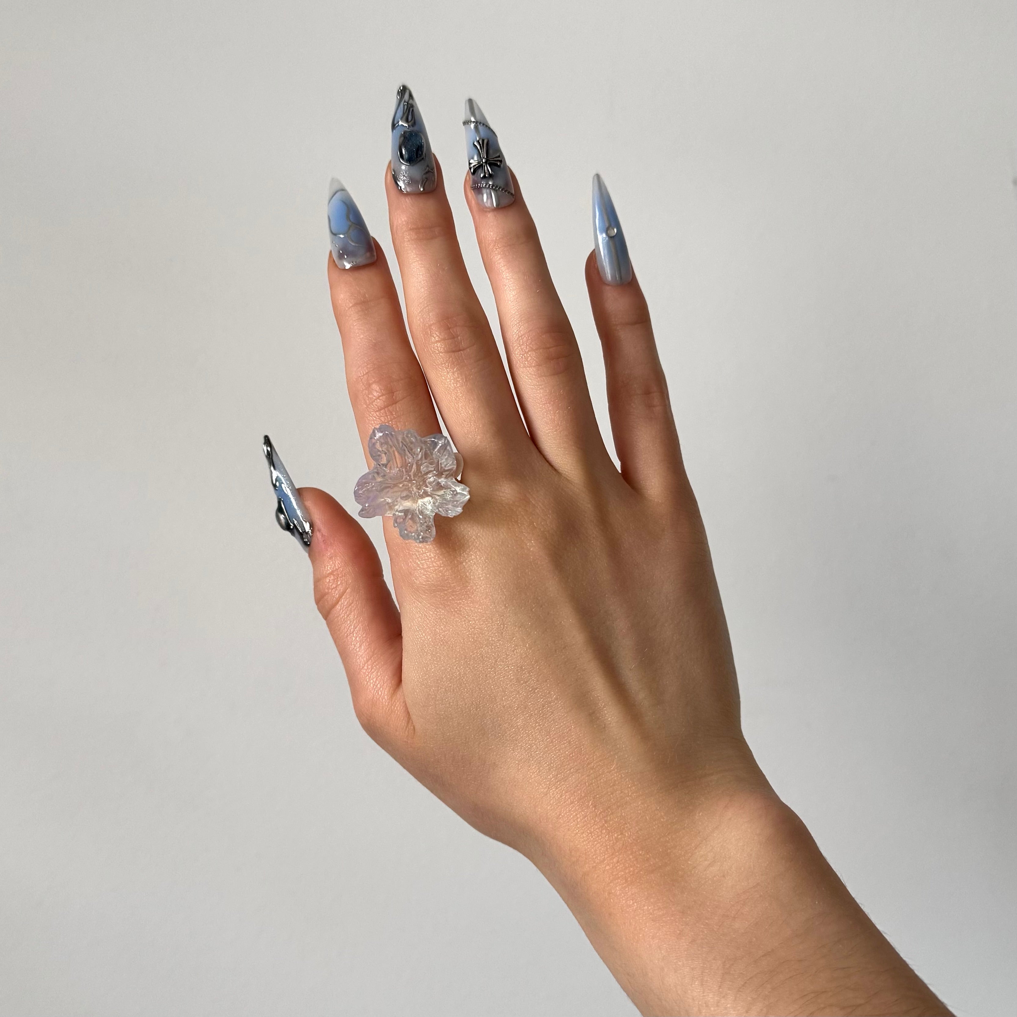 Hand wearing a clear glossy 3D printed resin statement ring
