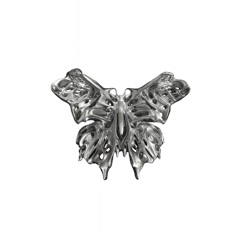 Silver butterfly-shaped statement ring on a white background