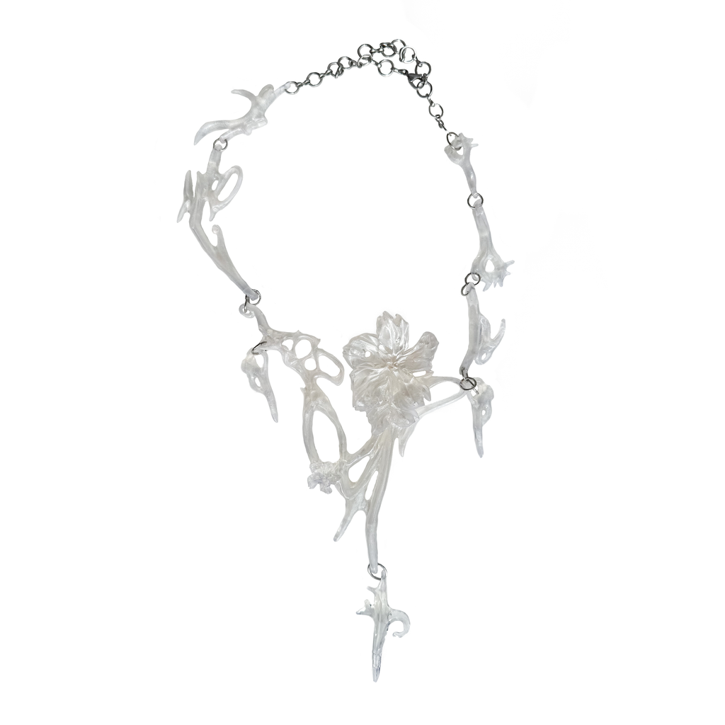 White opalescent floral fairy statement necklace on a white background