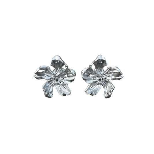 Pair of statement silver flower-shaped 3D printed earrings.